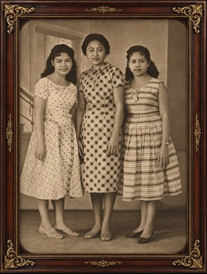 Lovingly restored sepia family portrait shines within rich rosewood frame, dressed with ornate gold inlay and elegant corner scrollwork. Three graceful women stand in timeless poise, their vintage dresses, soft expressions, and antique warmth creating a cherished heirloom look full of dignity, memory, and beauty forever.