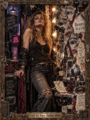 A defiant blonde rocker stands in a gritty backstage dressing room, surrounded by shattered mirrors, torn photographs, graffiti, and weathered memorabilia. Warm amber bulbs illuminate distressed leather and rusted metal against deep purple shadows. This richly textured mixed-media collage captures rebellion, vulnerability, and resilience within an ornate industrial frame.